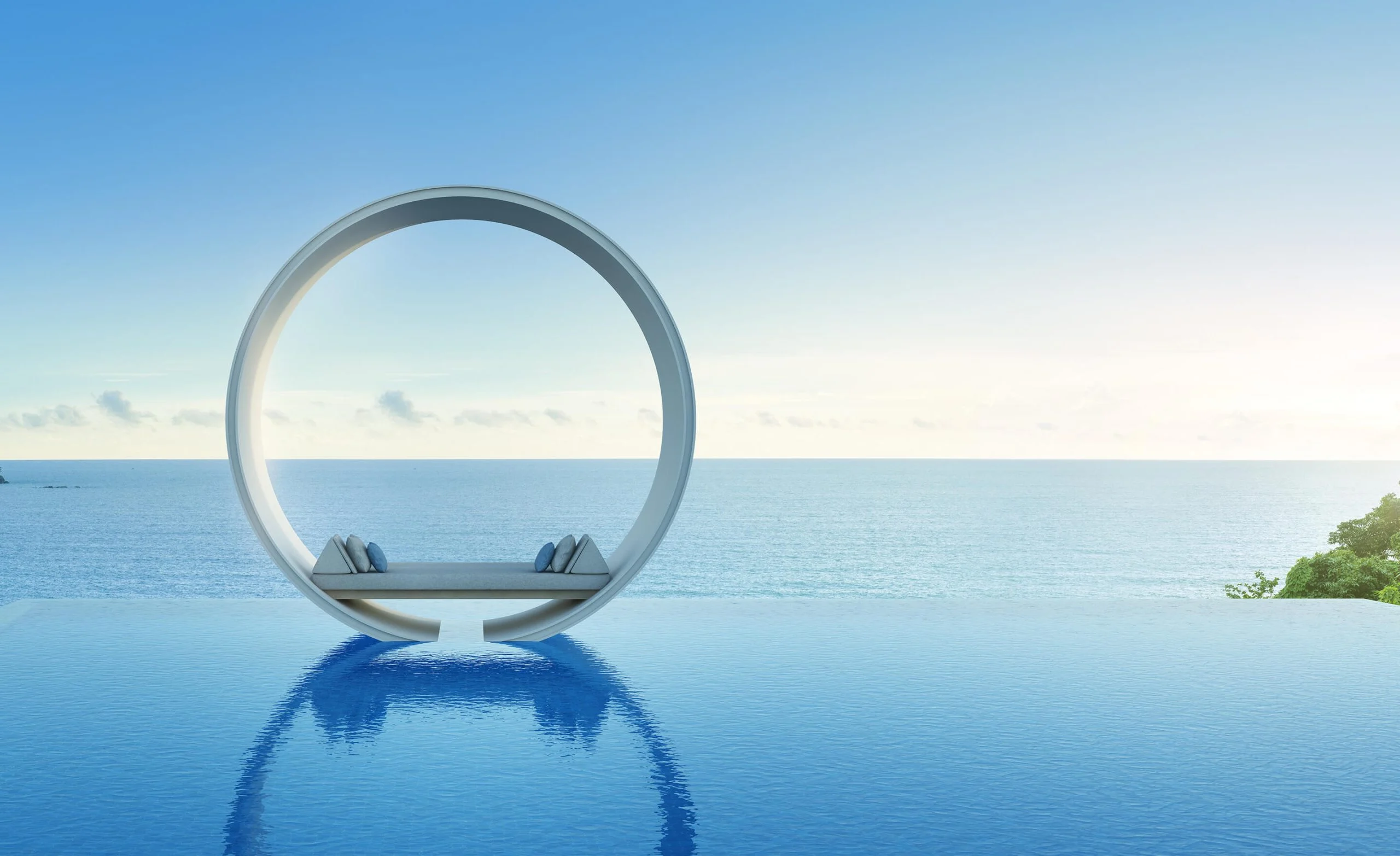 Sculptural arch beside an infinity pool facing the sea