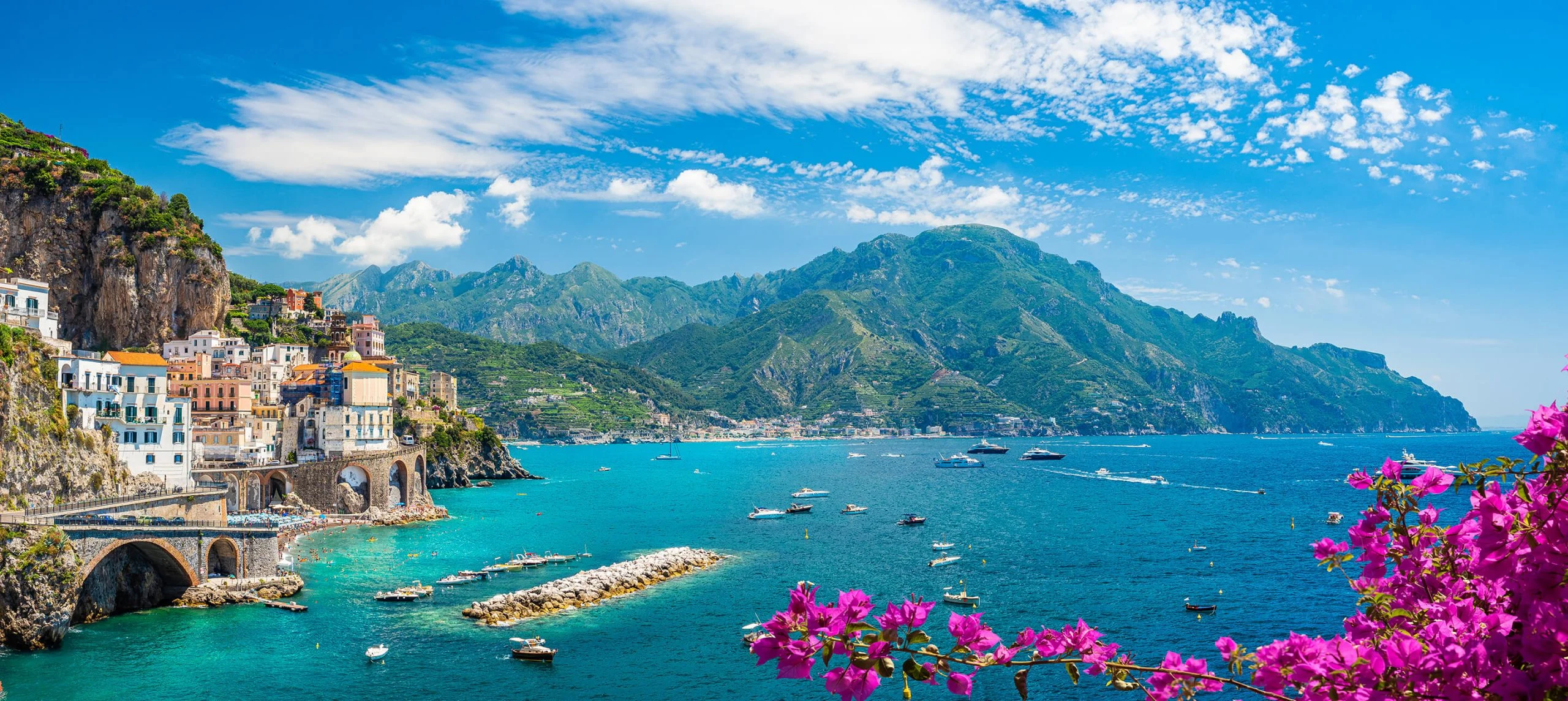 Amalfi Coast village seen through bougainvillea